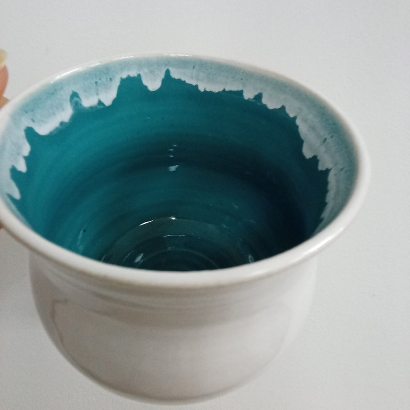 Hand thrown white with turquoise inside glaze mug