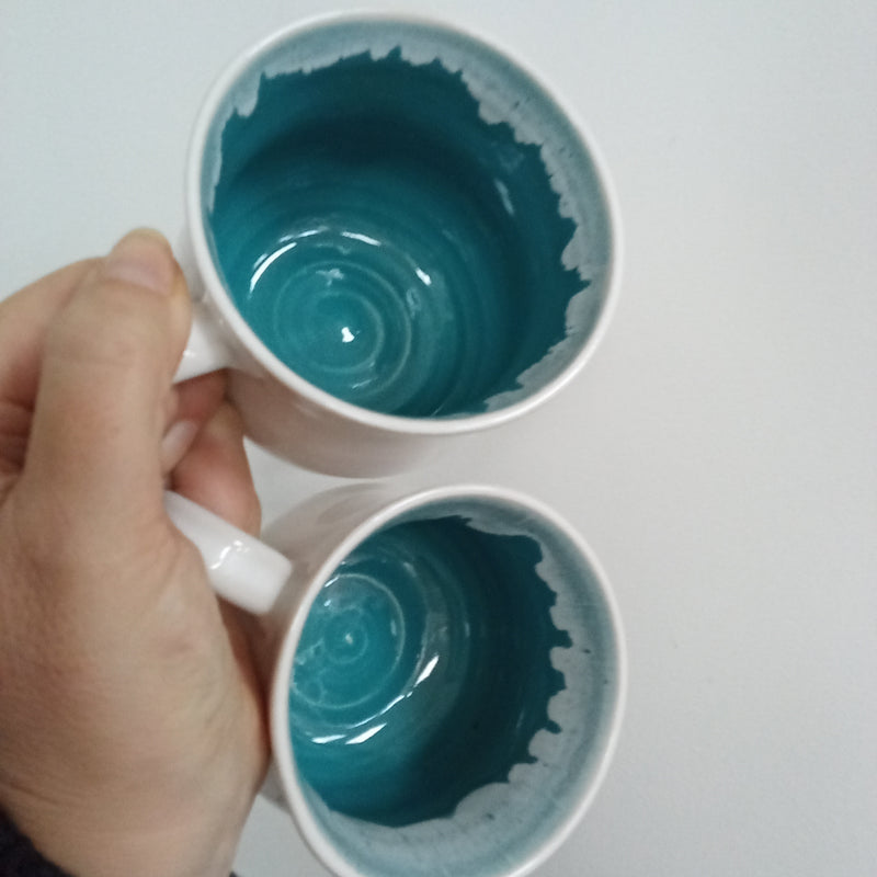 Hand thrown white with turquoise inside glaze mug