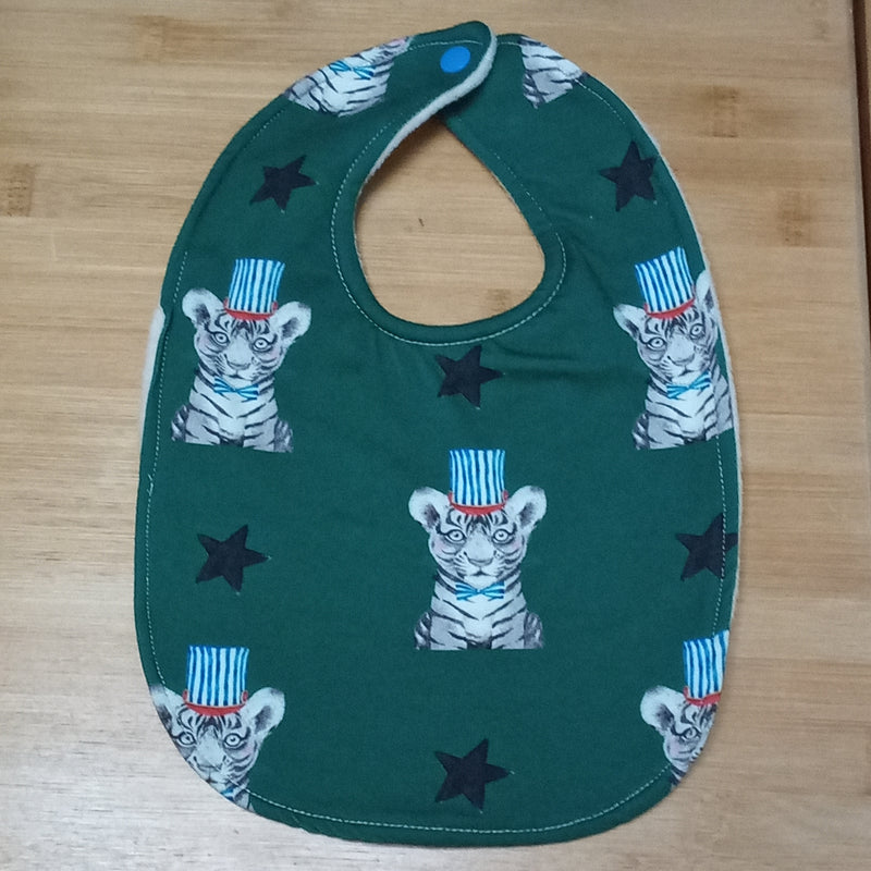 Traditional style bib - tigers in hats on green print