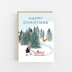 Happy Christmas girl with dog in pink sledge card