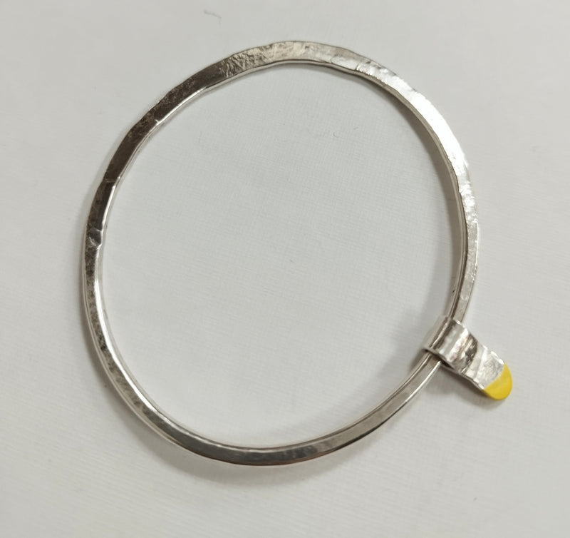 Sterling silver asymmetric bangle with yellow rubber dipped runner