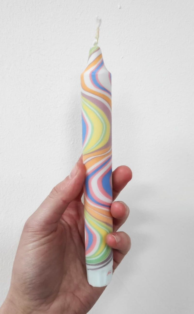 Multicoloured marbled dinner candles