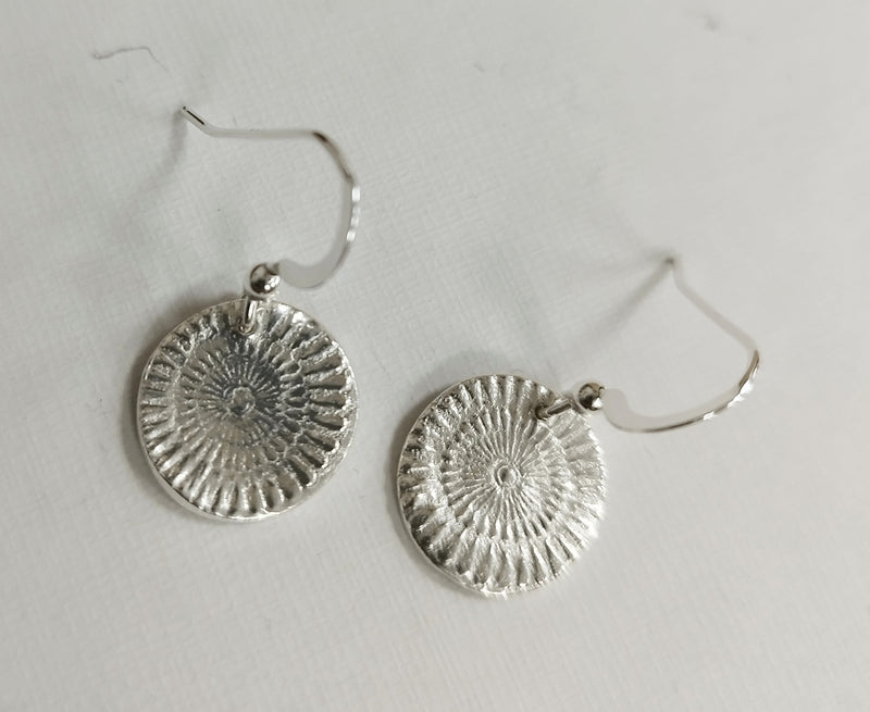 Silver sun disc drop earrings