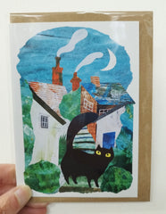 Black cat and houses card