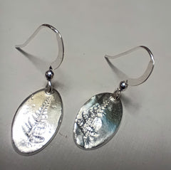 Fine silver fern imprinted oval earrings