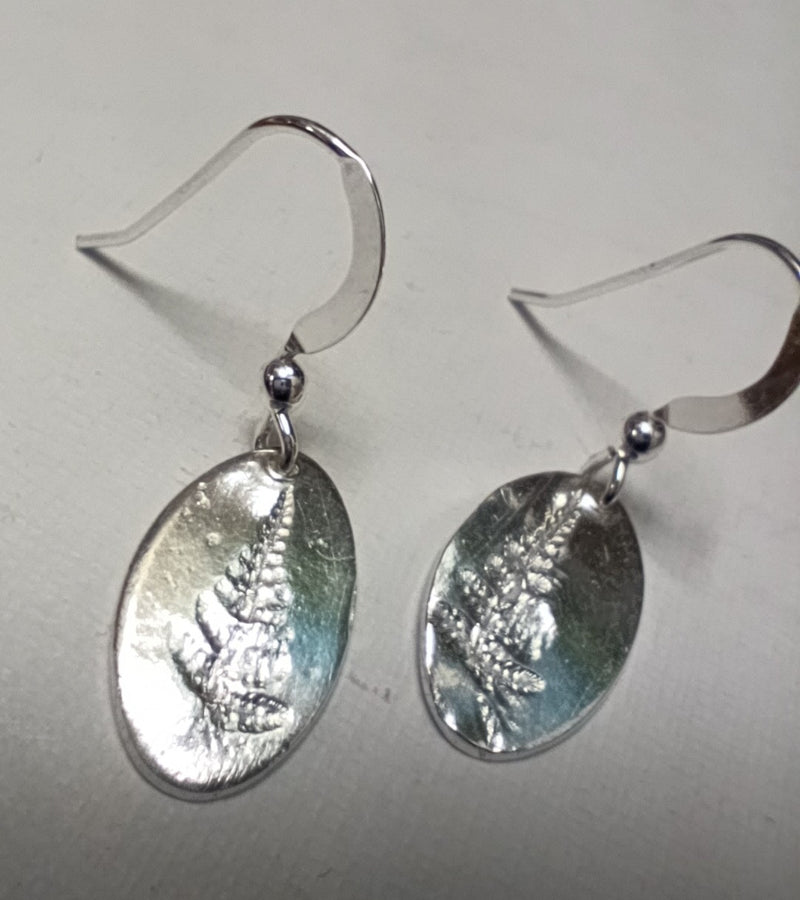 Fine silver fern imprinted oval earrings