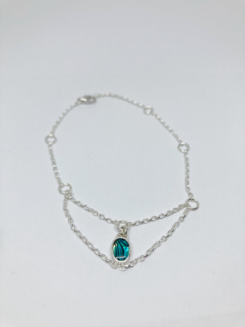 Sterling Silver draped chain bracelet with oval abalone stone