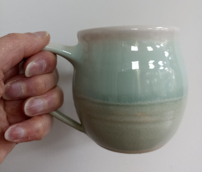 Hand thrown mug - pale green glaze