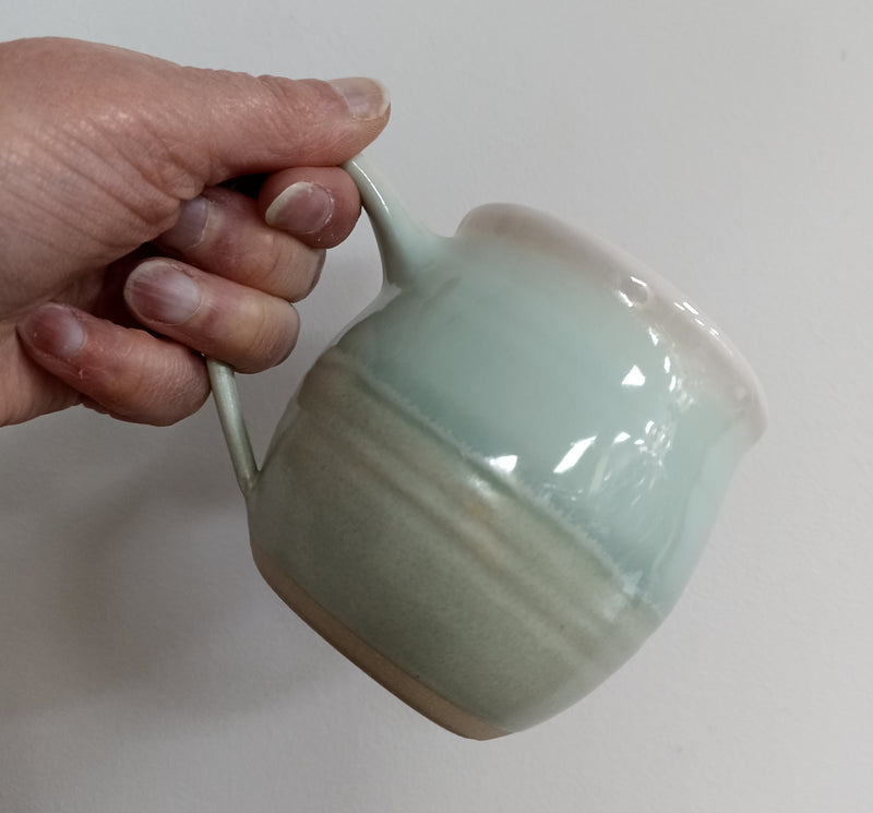 Hand thrown mug - pale green glaze