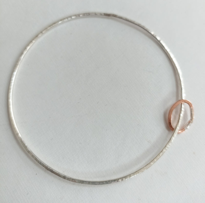 Sterling silver hammered bangle with copper runner