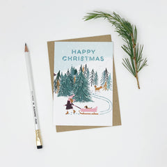 Happy Christmas girl with dog in pink sledge card