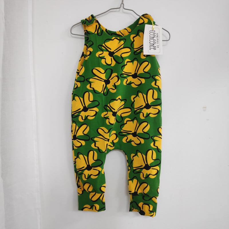 Romper suit - green with yellow flower patterns (0-6 months or 12-18 months)
