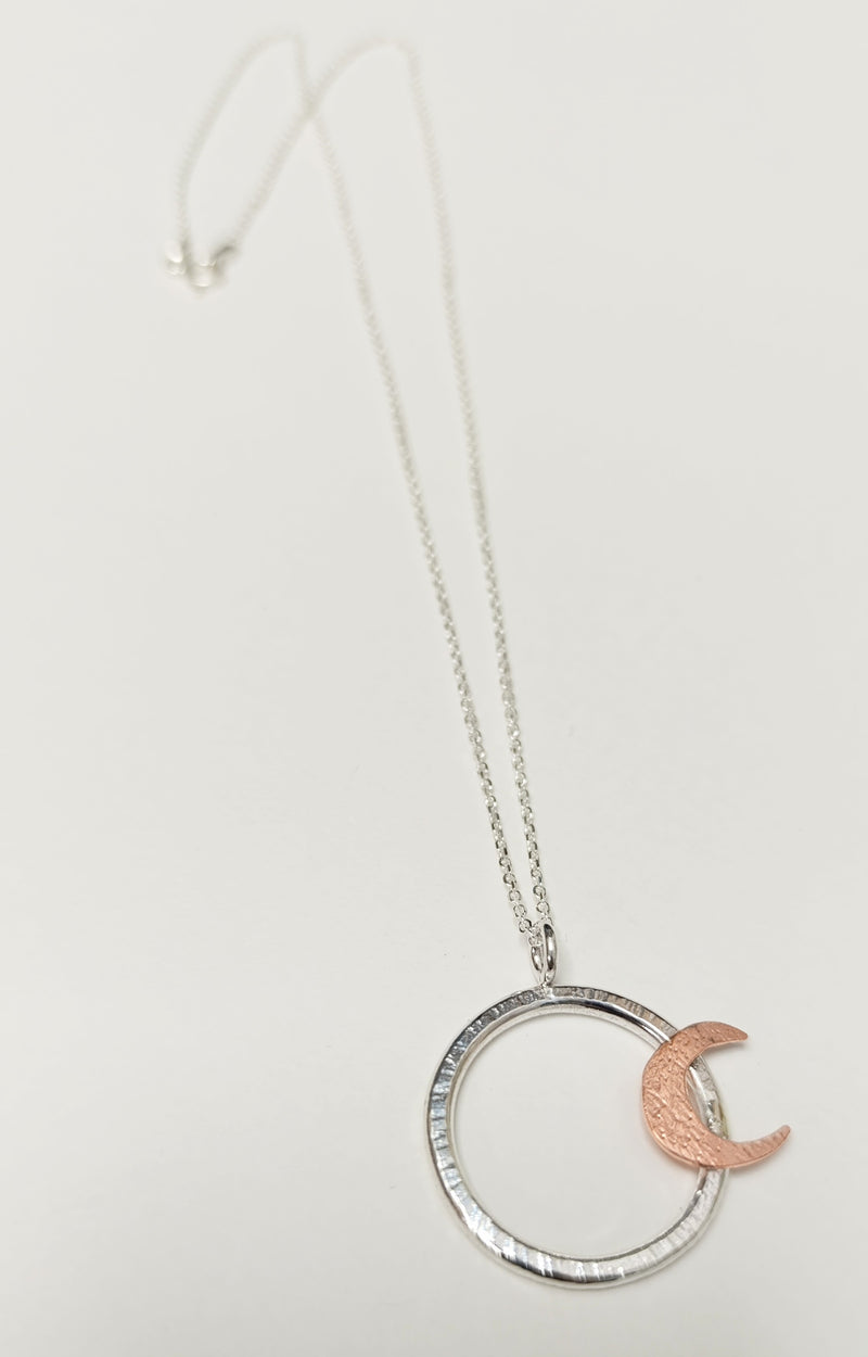 Sterling Silver hoop pendant with copper crescent