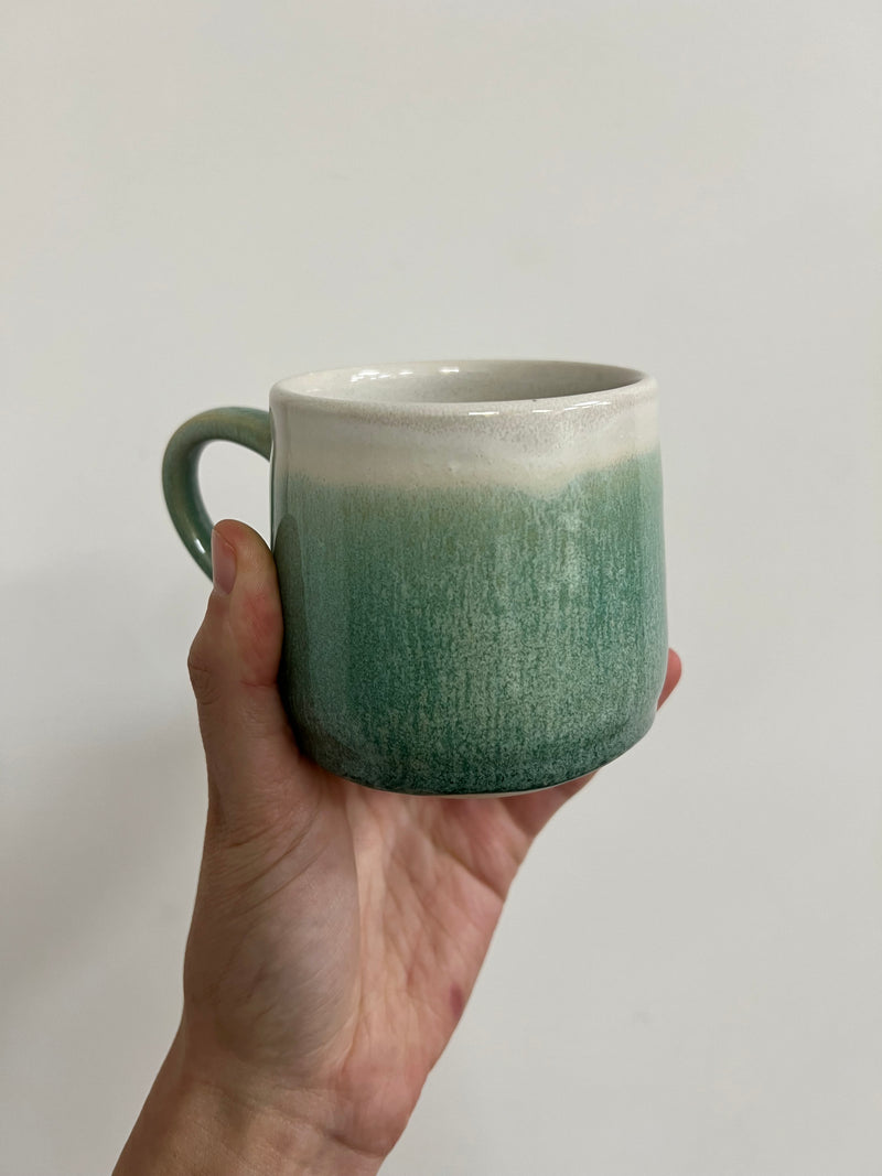 Hand thrown mug - pale green drippy glaze