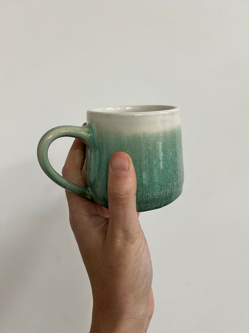 Hand thrown mug - pale green drippy glaze