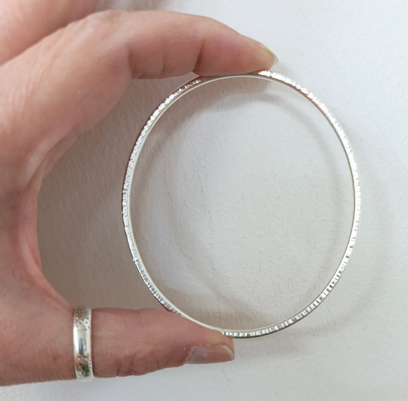 Sterling silver hammered oval bangle