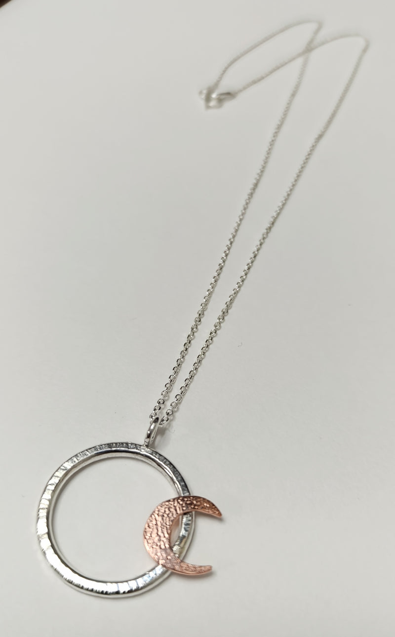 Sterling Silver hoop pendant with copper crescent