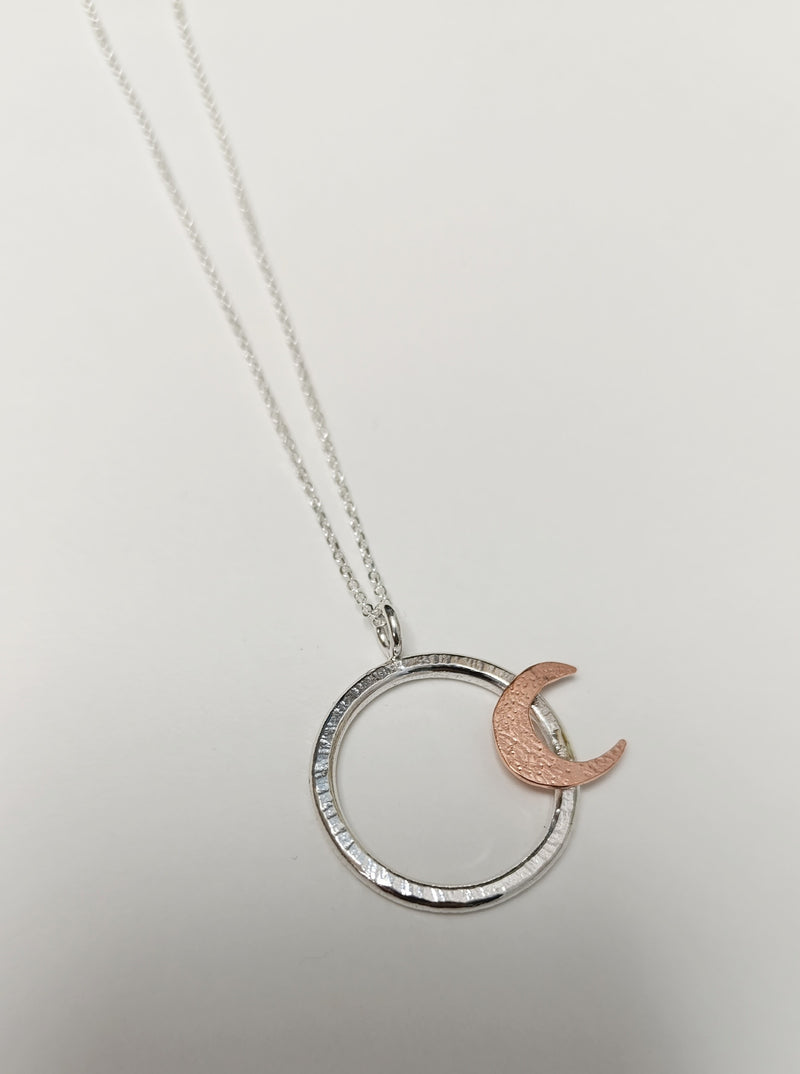 Sterling Silver hoop pendant with copper crescent
