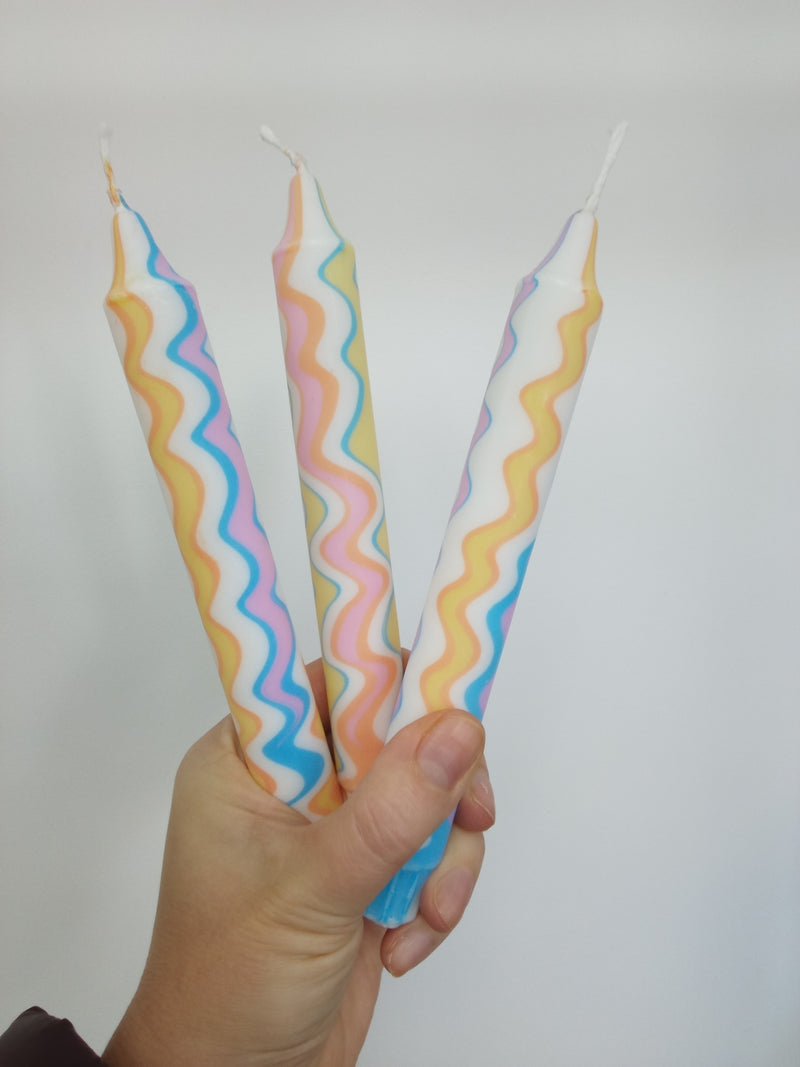 Rainbow zigzag dinner candles