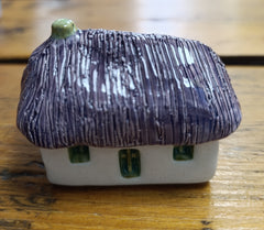 Ceramic Scottish bothy with thatched roof