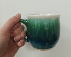 Hand thrown mug - dark green glaze