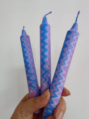 Lilac, blue and purple zigzag dinner candles