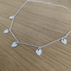 Sterling silver multi textured hearts necklace