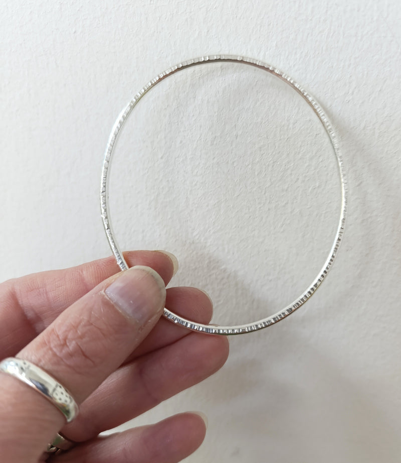 Sterling silver hammered oval bangle