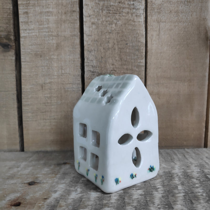 House tealight holder - pale green with star cut-outs and painted roof tiles and flowers
