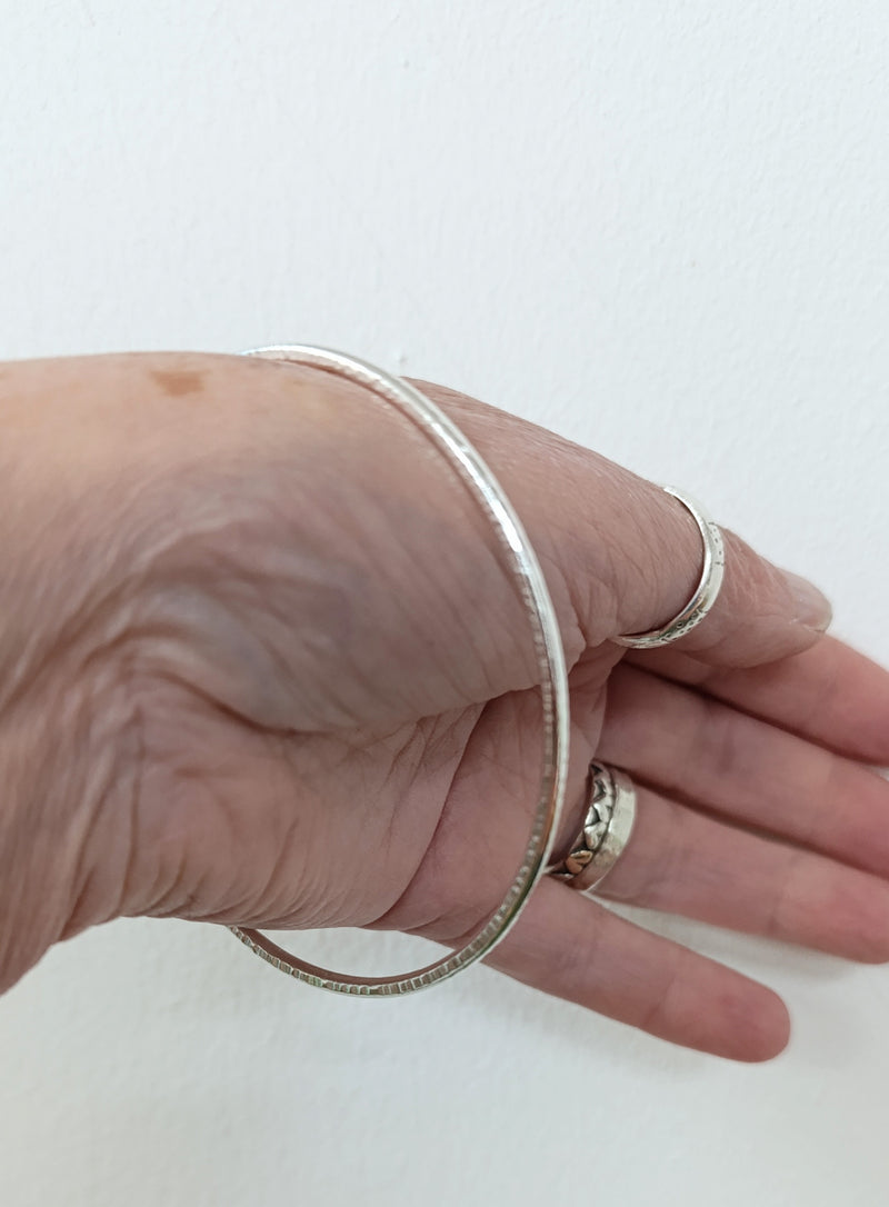Sterling silver hammered oval bangle