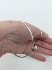 Sterling silver hammered oval bangle