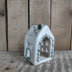House tealight holder - pale green with star cut-outs and painted roof tiles and flowers