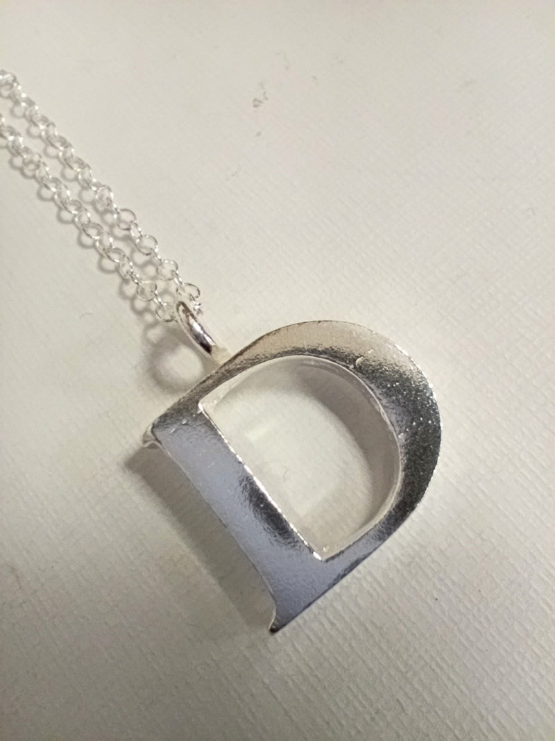 Sterling silver sand cast letter D necklace