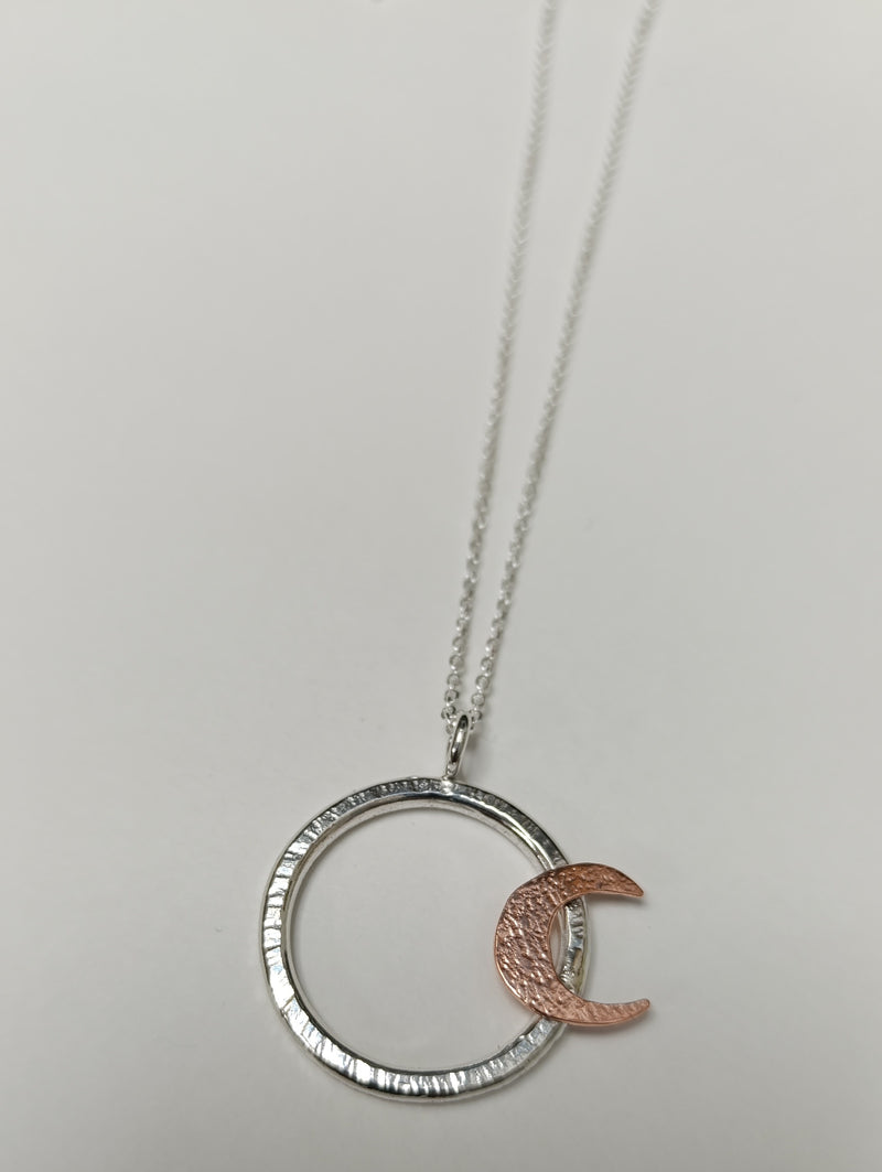 Sterling Silver hoop pendant with copper crescent