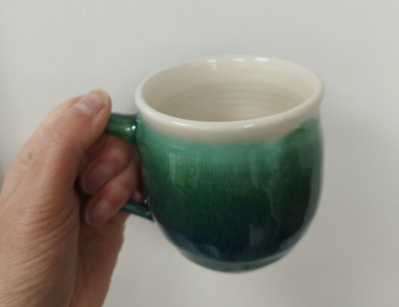 Hand thrown mug - dark green glaze