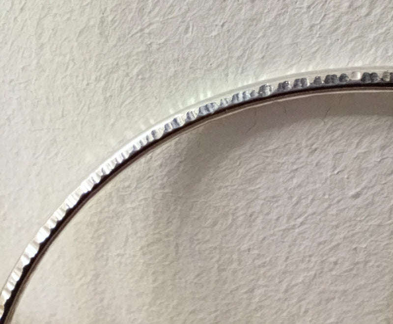 Sterling silver hammered oval bangle