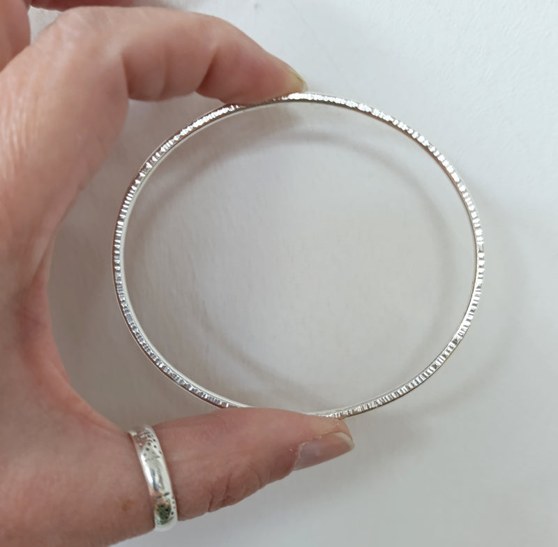 Sterling silver hammered oval bangle
