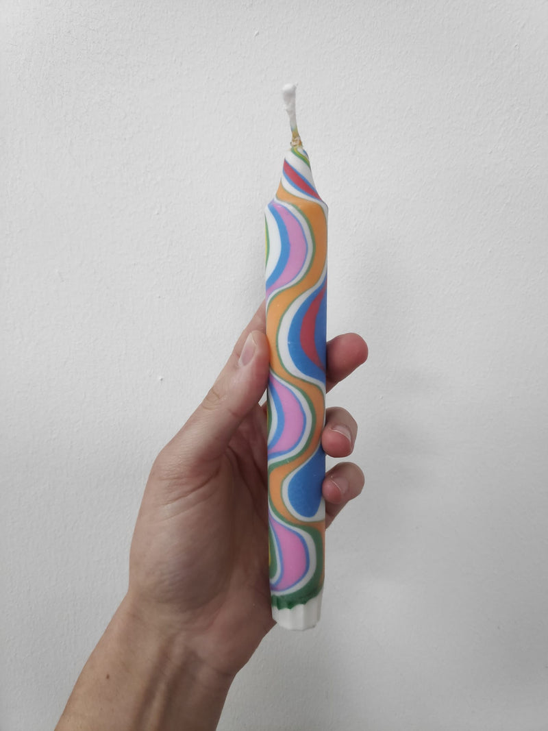 Multicoloured marbled dinner candles