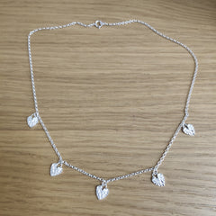 Sterling silver multi textured hearts necklace