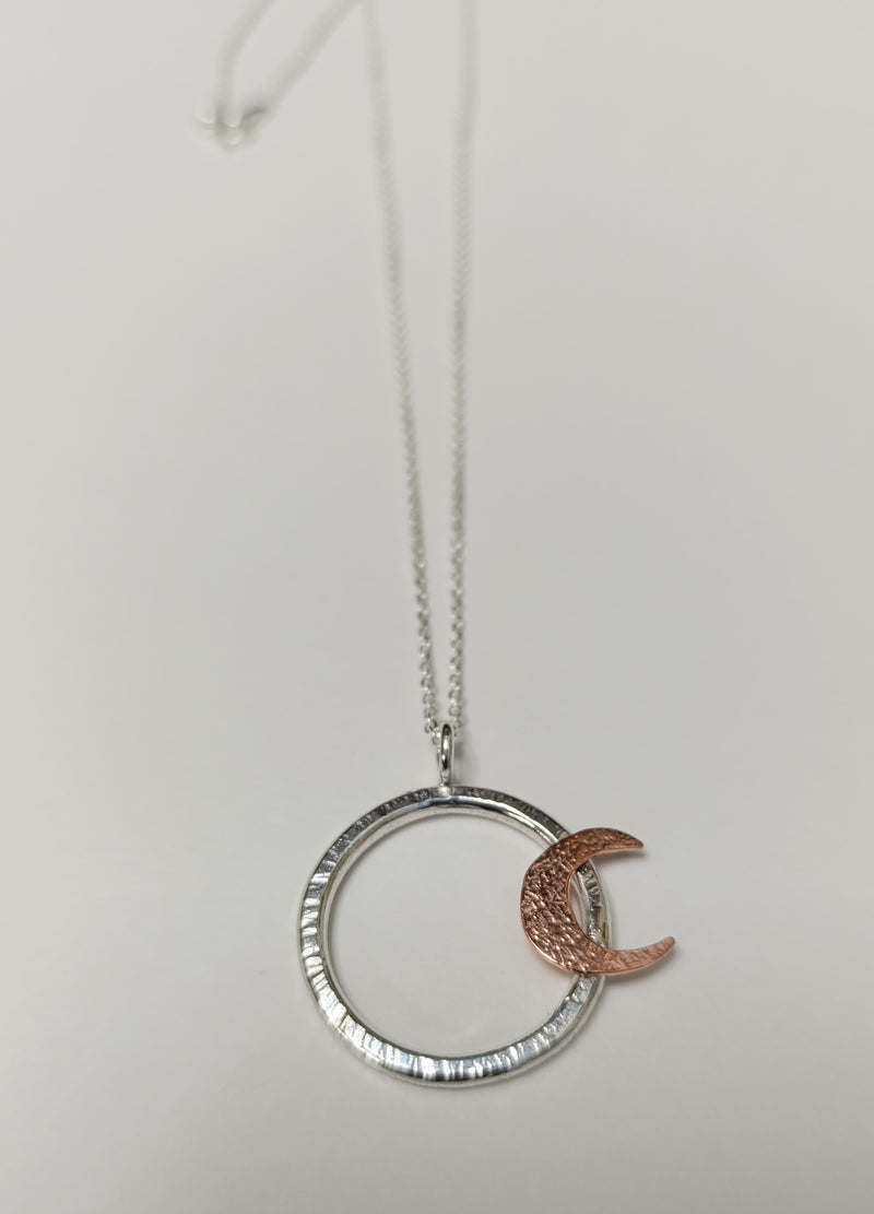 Sterling Silver hoop pendant with copper crescent