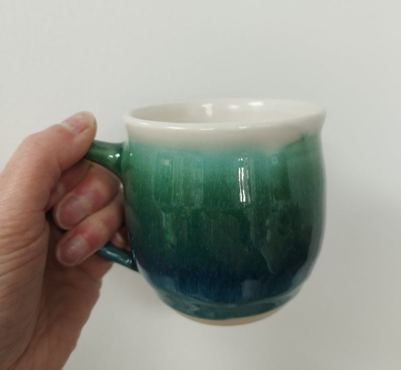 Hand thrown mug - dark green glaze