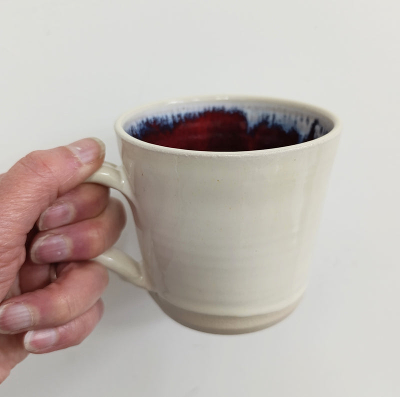 Hand thrown cream with inside terracotta glaze mug
