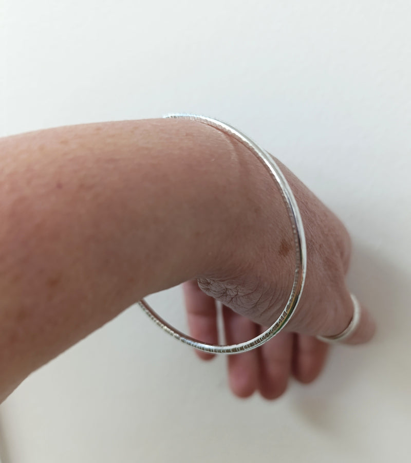 Sterling silver hammered oval bangle
