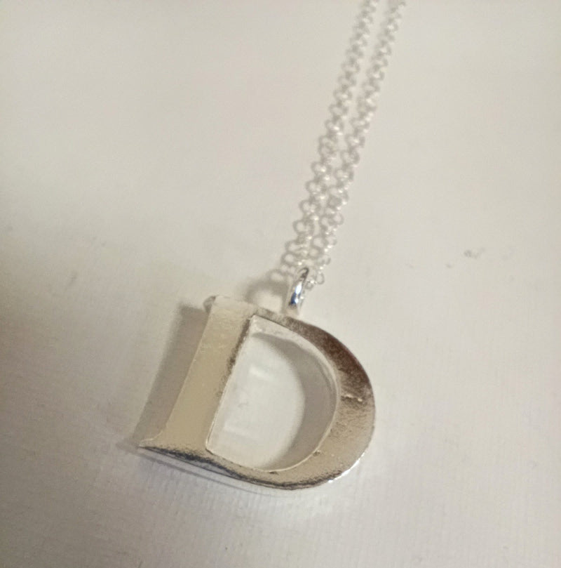 Sterling silver sand cast letter D necklace