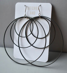 Large black plated brass triple hoop earrings