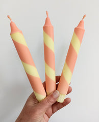 Coral and yellow stripe dinner candles