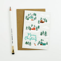Merry Christmas reindeer and houses in the snow card