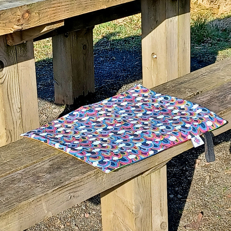 Waterproof sit mat - over the rainbow print