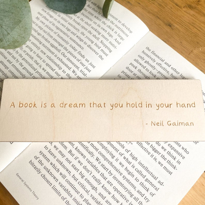 'A book is a dream you hold in your hands'' wooden bookmark