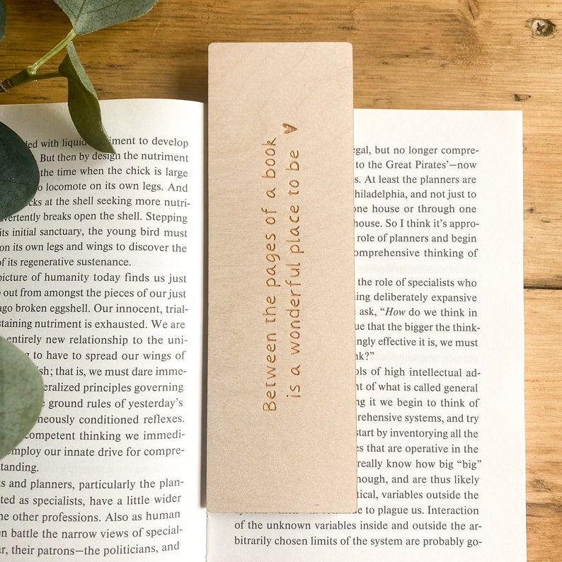 'Between the pages of a book is a wonderful place to be'' wooden bookmark